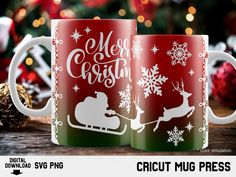 two coffee mugs with christmas designs on them