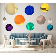 a living room filled with furniture and colorful circles on the wall