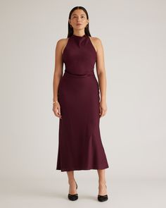 A new capsule must: our Washable Stretch Silk High Neck Midi Dress. Designed with a classic high neck and a flattering silhouette, this dress is cinched at the waist with crossed shoulder straps in the back. Like all of our silk, it’s washable, hypoallergenic, and thermoregulating to keep you comfortable.  | Quince | Women's Washable Stretch Silk High Neck Midi Dress in Wine Tasting, Size XS, Mulberry Silk Wedding Dress Code Guide, Wardrobe Color Guide, Dress Code Guide, Wine Colored Dresses, Beautiful Cocktail Dresses, Winter Wedding Guest Dress, High Neck Midi Dress, Dress Code Wedding, Wine Dress