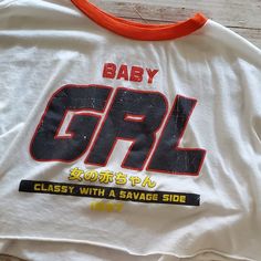 Fashion Nova Crop Top - "Baby Grl - Classy With A Savage Side - 1997" - Size Large - No Damages - See Photos For Measurements - Smoke Free Home *All Items Are Freshly Washed (Except If Item Is Nwt), Pictures Are Taken & Each Item Is Packaged Separately Right Away And Stored Waiting For Your Order. All Hard Goods Are Sanitized. Retro White Tops With Letter Print, Vintage White Tops With Letter Print, Retro White Slogan Tops, Baby Crop Top, Fashion Nova Tops, Tops Fashion, Orange White, Fashion Tops, Color Orange