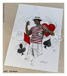 a card with a drawing of a man holding a heart and playing cards