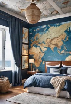 a bedroom with a large map on the wall above the bed, and blue curtains