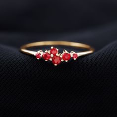 Product Details Get something trendy for her with this elegantly designed Promise Ring adorned with round shape Ruby in Prong Setting. This Cluster Ring is crafted in various metal options. Product Information SKU SHP-RINGS0821184990 Width 2 mm Height 5 mm Weight 1.04 gm (Approximate) RUBY INFORMATION No.of Stones 6 Pieces Total Weight 0.42 Carat (Approximate) Dimension(approx) Round-1.50X1.50 mm-2 PcsRound-2.50X2.50 mm-3 PcsRound-2X2 mm-1 Pcs Color Red Cut Brilliant Shape Round Setting Type Pro Red 14k Gold Cluster Ring For Promise, Gold Cluster Ruby Promise Ring, Red Round Cluster Promise Ring, Ruby Cluster Ring For Promise Occasion, Ruby Ring With Polished Finish For Promise, Round Cut, Ring Sizer, 18k Yellow Gold Ring, Natural Ruby, Ruby Ring