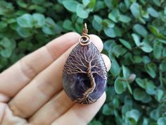 "Amethyst Tree Of Life Pendant - choose a unique gift for any occassion: Mothers Day, Fathers Day, Valentine's Day, Thanksgiving Day, Graduation, Copper Anniversary, Birthday, Christmas, New Year etc. This Tree Of Life Pendant is made of copper wire and natural Amethyst. The pendant is oxidized and polished. Any tarnishing that occurs naturally over time can be easily polished away with a silver polishing cloth. This Amethyst Pendant is made in a wire wrap technique. You will get it in a kraft b Purple Amulet Jewelry As A Gift, Purple Amulet Jewelry As Gift, Purple Amulet Style Jewelry Gift, Bohemian Teardrop Crystal Necklace For Gift, Mystical Amethyst Necklace For Gift, Handmade Lavender Necklace For Meditation, Lavender Handmade Necklace For Meditation, Mystical Amethyst Crystal Necklace Gift, Amethyst Amulet Jewelry As Gift