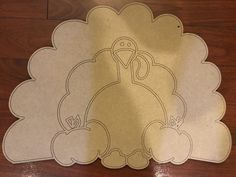 a turkey cut out on top of a wooden floor