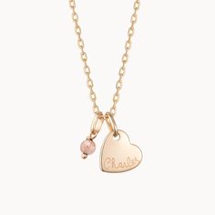 Our Personalized Mini Gemstone Heart Necklace is a touch of love for those that fill your heart with joy. The perfect personalized gift for a new mum, each necklace features a colorful gemstone to pair alongside a heart charm, hand-engraved with the name and birth date of their new arrival.&nbsp;Please note that there may be slight variations between each gemstone due to its origins.18K Champagne Gold Plated or 925 Sterling SilverMini Flat Heart: 0.4 x 0.4Mini Gemstone: 0.15 x 0.15 x 0.1Secure clasp fasteningCharms are removable from this chain and can be worn on all Merci Maman chain lengthsHand-engraved in our Paris workshopSent with love in a complimentary gift boxPlease note that necklaces that have several charms may develop a certain patina, giving it a unique style.Any slight va Heart-shaped May Birthstone Necklace With Gemstone, May Birthstone Heart Necklace, Dainty Heart Pendant Birthstone Charm Necklace, Heart Cut Birthstone Necklace For Keepsake, Heart-shaped May Birthstone Necklace, Personalized Birthstone Charm Necklace With Heart Pendant, Personalized Heart Pendant Charm Necklace With Birthstone, Birthstone Charm Necklace With Heart Pendant, Heart Pendant Necklace With May Birthstone