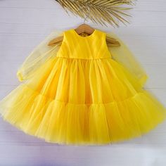 "Perfect first birthday dress for a little Princess! This beautiful dress is suitable for baby girls, kids and toddlers! Perfect outfit for formal events, as flower dress, birthday party and fairy photo shoot. The dress is made of yellow tulle and has long sleeves. The bodice is decorated with elegant tulle draping. This dress is very lightweight and fluffy. The tulle is soft and not itchy, it is very comfortable for kid's skin. We make dresses in standard sizes and by individual measurements. I Yellow Flower Girl Dress, Tulle Dress Long Sleeve, Tulle Draping, Fairy Photo Shoot, Yellow Baby Dress, Yellow Flower Girl, Yellow Flower Girl Dresses, Frocks For Babies