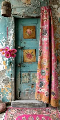 an old door is painted blue and pink