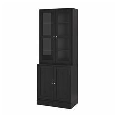 a tall black cabinet with glass doors on the top and bottom shelf, in front of a white background