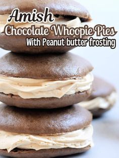 chocolate whoopie pies with peanut butter frosting stacked on top of each other