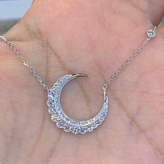 Stunning Diamond Moon Necklace.  Excellent craftsmanship and details.  The diamonds are very sparkling.  You have to see in person.  Lays perfectly on the neck.  The cable link chain is strong and comes with adjustable loops on the chain to be able to wear at 18", 17" or 16" lengths.  The moon is just slightly bigger than a nickel. About 22.1mm.    YELLOW GOLD SOLD OUT.  Genuine natural round brilliant cut diamonds total weight: 1.05 Carats Clarity: SI Color: F All very sparkling diamonds, no cl Silver Crescent Diamond Necklace, Elegant Jewelry With Moon Shape And Adjustable Chain, Elegant Moon-shaped Jewelry With Adjustable Chain, Elegant Moon Shaped Jewelry With Adjustable Chain, Elegant Necklace With Moon Charm In Cubic Zirconia, Elegant Jewelry With Adjustable Chain And Moon Shape, Elegant Necklace With Moon Charm And Cubic Zirconia, Elegant Cubic Zirconia Necklace With Moon Charm, Elegant Half Moon Clavicle Chain Necklace