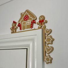 gingerbread cutouts are on top of a white door