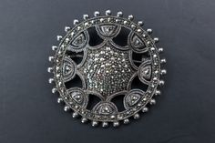 "Elevate your style with our exquisite Large Silver Marcasite Brooch, reminiscent of a vintage steering wheel, and exuding Art Deco charm. This elegant circle pin is a timeless statement piece, making it the perfect unique jewelry gift for women. Shop now to add a touch of classic sophistication to your collection. ❗️ Details: Vintage from the 1960s Length: 1.5 Inches; Width: 1.5 Inches Materials: Silver, Stone Style: Art deco Good vintage condition, some crystals are missing 🎁 And if you happen to be a gentleman shopping for a gift for your lady, here's a couple of tips: 1) There's no such thing as \"too much jewelry\". 2) Any woman would love jewelry as a gift regardless of her age - and yes, that includes your grandma. 3) Designer jewelry is always a safe choice - you don't have to wor Silver Art Deco Filigree Brooches, Luxury Silver Vintage Brooches, Real Pearl Jewellery, Silver Art Nouveau Brooches For Gifts, Art Nouveau Silver Brooch, Y2k Necklace, Handmade Boho Jewelry, Luxury Collectible Art Nouveau Brooch, Unique Jewelry Gifts