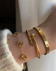 Discover the allure of the Cartier Nail Bracelet paired with a stunning Four Leaf Clover design. A perfect match of luxury and charm. Cartier Nail Bracelet, Xoxo Jewelry, Gold Bracelets Stacked, Nail Bracelet, Expensive Jewelry Luxury, Wrist Jewelry, Luxe Jewelry, Luxury Bracelet, Bangles Jewelry Designs