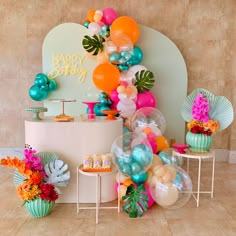 an assortment of balloons and decorations for a birthday party