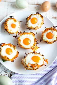 eggs are arranged in the shape of hearts on a white plate