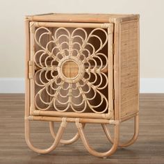 a wicker and rattan side table with an intricate design