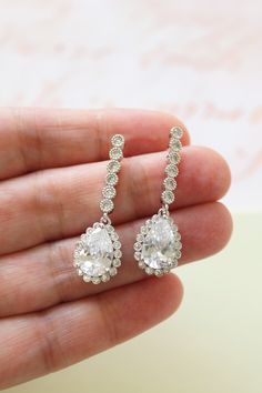 Tiny Vintage Style Bridal Earrings, Art Deco Earrings, Wedding Earrings Tiny  vintage style zircon  earrings  Colour: rhodium(silver tone) /clear Measurements: approx 3.6 cm x 1cm .  Materials:  rhodium components, zircon crystals . Stud earrings. Great for wedding or other celebration. MORE SAME STYLE: https://www.etsy.com/uk/shop/BridalArtDeco?ref=listing-shop-header-item-count&section_id=23918122 Please note some images have been enlarged to allow for details to be shown. Read the description Elegant Drop Diamond Earrings For Wedding, White Chandelier Earrings With Prong Setting For Wedding, Wedding Diamond Dangle Earrings With Prong Setting, Wedding Diamond Earrings With Prong Setting, Sterling Silver Cluster Earrings For Wedding, Wedding Halo Earrings In Cubic Zirconia, White Pear-shaped Diamond Earrings For Wedding, Wedding Halo Design Cubic Zirconia Earrings, Cubic Zirconia Halo Earrings For Wedding