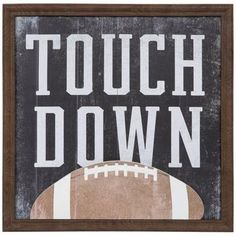 a wooden sign that says touch down with a football on the front and side of it