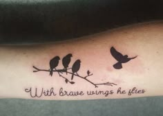 a tattoo with three birds sitting on a branch that says, with brave wings he flies