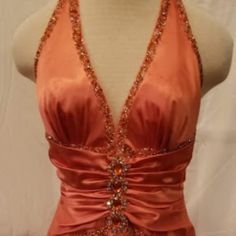 Gorgeous Peach Salmon With Rhinestone Crystal Embellishments. Deep V Neckline With Low Back And Criss Cross Straps. Full Length With Mermaid Style Hemline. Small Line From Snag In The Satin On Breast As Seen In Picture. Funky Prom Dress, Elegant V-neck Pageant Dress, Elegant V-neck Gown For Pageants, Fitted V-neck Gown With Rhinestones, Sleeveless Rhinestone Gown For Formal Occasions, Formal Evening Dress With Rhinestones And Fitted Bodice, Formal Gown With Rhinestones And Fitted Bodice, Elegant Fitted Bedazzled Gown, Formal Fitted Gown With Rhinestones