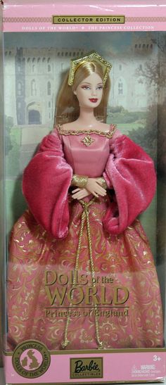 barbie doll in pink dress with gold trim and red cape on it's head