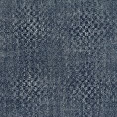 an upholstered blue denim fabric background