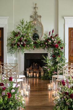 the ceremony room is decorated with candles, flowers and greenery for an elegant touch