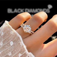 a woman's hand with a diamond ring on top of her finger and the words black diamonds above it