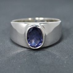 Sterling silver ring with iolite or cordierite setting.  Sizes available see above "finger size" "select an option" and choose your finger size. This ring has been sold to both ladies and men customers so there is a big range of finger sizes available.  Stone size 8x6mm/0,32x0,24 inches. Weight of silver 5gm/0,176oz.   Also available with other gemstones: blue topaz, garnet & peridot. Modern Tanzanite Gemstone Ring, Modern Tanzanite Sapphire Promise Ring, Classic Silver Tanzanite Rings, Silver Tanzanite Promise Ring, Modern Oval Tanzanite Sapphire Ring, Modern Tanzanite Round Rings, Silver Sapphire Gemstones For Promise Ring, Silver Tanzanite Ring With Center Stone, Tanzanite Bezel Setting Promise Ring