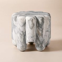 a marbled table with three columns on it