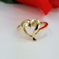 14k Gold Ring with a heart in the center. For only $289.00. Purchase comes with a gift box included. Ring size is adjustable, please note the size in the personalization section of checkout. 14k Gold Open Heart Polished Jewelry, 14k Gold Open Heart Jewelry With Polished Finish, Polished 14k Gold Open Heart Jewelry, Gold Heart Ring With Polished Finish, Adjustable Gold Heart Ring For Valentine's Day, Heart-shaped Yellow Gold Rings For Formal Occasions, Formal Yellow Gold Heart Ring For Valentine's Day, Classic Gold Heart Ring With Heart Charm, Adjustable Yellow Gold Rings For Valentine's Day