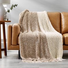 a couch with a blanket on top of it