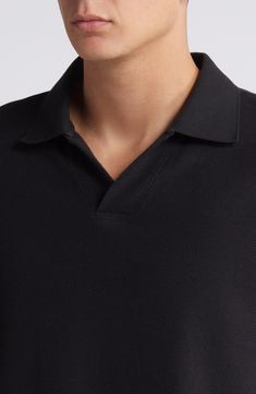 Build your casual look with the versatile style of this polo made from cool, breathable cotton jacquard. 26 1/2" length (size Medium) Spread collar Short sleeves 100% cotton Machine wash, tumble dry Imported Black Cotton Polo Sweater For Work, Black Polo Collar Sweater For Work, Black Polo Sweater With Collared Neckline For Workwear, Black Short Sleeve Polo Sweater For Work, Black Polo Shirt With Seamless Collar For Work, Classic Black Polo Sweater With Johnny Collar, Black Cotton Polo Shirt For Business Casual, Black Fitted Cotton Polo Sweater, Fitted Black Cotton Polo Sweater