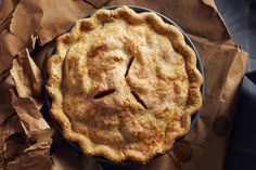 a pie sitting on top of a piece of brown paper