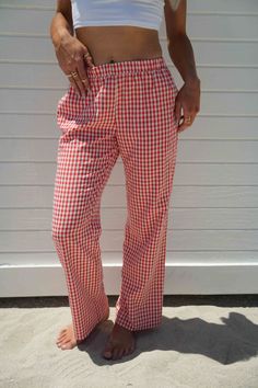 Score trendy Gingham Pants made of cotton canvas in a red check pattern. Designed with a comfy fit and a low waist, these bottoms will elevate your look when worn with a top and stylish boots or heels. pants 50% cotton 50% polyester lininig 100% rayon gingham print inner drawstring tie elastic waistband double pocket at back non stretch fully lined models are both wearing size medium Casual Gingham Cotton Bottoms, Red Bottoms For Spring Picnic, Red Spring Bottoms For Picnic, Plaid Cotton Bottoms For Picnic, Gingham Cotton Pants, Plaid Cotton Bottoms With Elastic Waistband, Red Bottoms For Summer Picnic, Red Summer Bottoms For Picnic, Cotton Gingham Bottoms For Loungewear