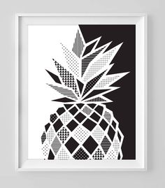 a black and white pineapple art print on a wall