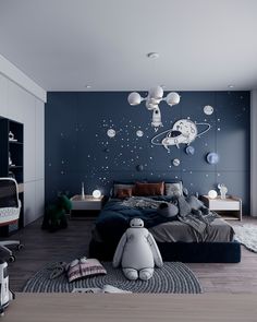 a bedroom with blue walls and space themed decor