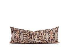 a decorative pillow with an animal print pattern on the front and back, sitting on a white background