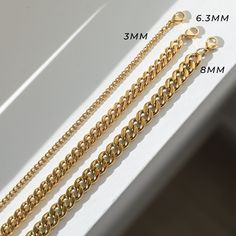 Our Curb chain bracelet is the perfect minimalist everyday gold bracelet. Meant for everyday wear and great for people with sensitive skin. Also an affordable alternative to solid 18k gold because this necklace is waterproof and tarnish resistant. Hypoallergenic Stainless Steel with thick layer of 18k gold PVD coating. BUY 2, GET 1 FREE. Coupon applied at checkout. - 18k gold plated- Bracelet length: 6.5 inch with 2 inch extension- Bracelet width available in 3mm / 6.3mm / 8mm- Waterproof / Tarn Minimalist Gold Bracelet With Curb Chain, Minimalist Gold Cuban Link Chain Bracelet, Minimalist Gold Plated Curb Chain Bracelet, Minimalist Gold-plated Curb Chain Bracelet, Classic Cuban Link Bracelet With Chunky Chain For Everyday, Minimalist Tarnish-resistant Cuban Link Chain Bracelet, Gold Curb Chain Bracelet For Everyday, Everyday Cuban Link Bracelet With Figaro Chain, Everyday Gold Curb Chain Bracelet