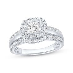 a diamond ring with two rows of diamonds on the band and a center stone surrounded by round