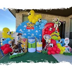 a toy story birthday party with balloons and decorations