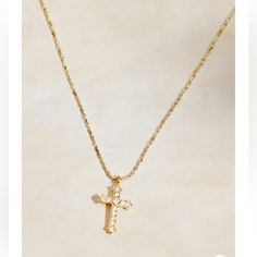 This Timeless Necklace Features A Shimmering Cubic Zirconia Cross Pendant Crafted In 18k Gold Plating. The Classic Design Adds A Touch Of Elegance And Faith To Any Ensemble. Fit: Adjustable Closure: Clasp Material: 18k Gold Elegant Cubic Zirconia Cross Necklace With Clavicle Chain, Classic Cubic Zirconia Cross Necklace As Gift, Classic Cubic Zirconia Cross Necklace For Gift, Gold Diamond Cross Pendant Necklace For Wedding, Gold Diamond Cut Cross Necklace As Gift, Gold Pendant Cross Necklace Fine Jewelry, Gold Necklace With Diamond Accents In Dainty Style, Gold Cross Necklace With Diamond Accents For Anniversary, Dainty Gold Necklace With Diamond Accents