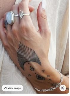 a woman's arm with a tattoo on it