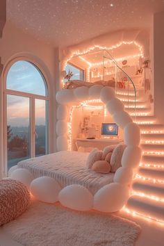 a bedroom decorated in white with lights on the ceiling and stairs leading up to it