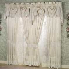 the curtains in this room are lined with lace