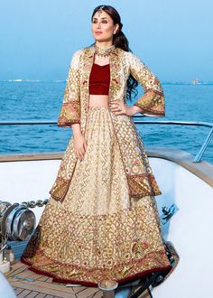 Pakistani Bridal Nauratan Lehnga for Wedding in Traditional style emblazoned with pretty work. Available with Fast Deliver in USA. Buy Online. Gold Wedding Dress With Intricate Embroidery For Reception, Wedding Gown For Eid Made Of Kundan, Kundan Gown For Wedding And Eid, Embroidered Kundan Floor-length Gown, Kundan Wedding Gown For Eid, Gold Embroidered Wedding Dress For Reception, Traditional Raw Silk Wedding Gown, Wedding Lehenga With Dabka Work In Raw Silk, Bollywood Floor-length Wedding Dress With Zari Work