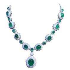 An exquisite design , very glamour and refined, by Italian designer , a very piece of art. Necklace come in 18k gold , with 18 pieces of natural Zambia emeralds, oval cabochon cut, fine quality , of 46,80 total carats. Pendant emerald is of 12,56 carats. Necklace come with natural diamonds of 13 carats,F/VS top quality. On this necklace , pendant is mobile, but on request , I can do fix . It is a high jewelry piece. Handcrafted by artisan goldsmith. Excellent manufacture and quality. Complete wi Formal White Gold Emerald Necklace With Jewels, Dazzling Jeweled Emerald Necklace For Formal Events, Opulent Round Necklaces For Formal Occasions, Dazzling Formal Emerald Gemstone Necklace, Luxury Emerald Necklace With Jewels For Formal Occasions, Exquisite Jeweled Emerald Necklace For Anniversary, Luxury Emerald Necklace With Jewels For Formal Events, Luxury Emerald Necklace For Formal Events, Luxury Oval Emerald Necklace With Jewels