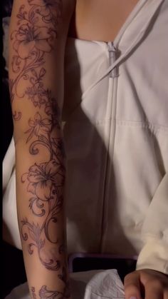 a woman with a tattoo on her arm