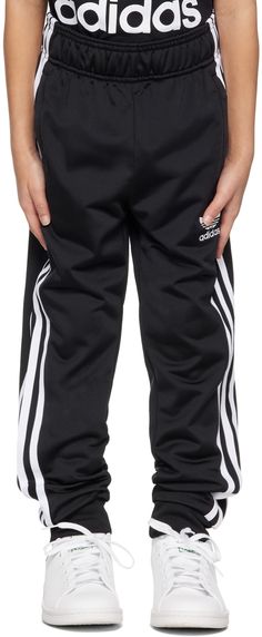 Recycled polyester jersey track pants. · Concealed drawstring at elasticized waistband · Two-pocket styling · Logo embroidered at front · Rib knit cuffs · Stripes at outseams · Machine-wash Supplier color: Black/White Model measures 47��” / 119.4 cm tall and wears size XS. adidas Kids Size: child's height XS: 48.5 - 50.5 / 123 - 128 cm S: 53.5 - 55 / 135 - 140 cm M: 58 - 60 / 147 - 152 cm L: 62.5 - 64.5 / 159 - 164 cm XL: 67.5 - 69.5 / 171 - 176 cm Adidas Kids, Kids Black, Knit Cuff, Logo Embroidered, Big Kids, Kids Boys, Kids Clothing, Track Pants, Adidas Originals